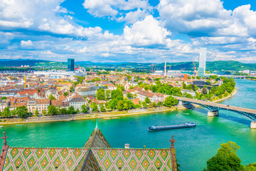 Riverside of Rhine dominated by the Roche tower in Switzerland - obrazy, fototapety, plakaty