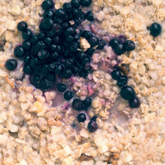 Granola with blueberries, toned. Top view, copy space