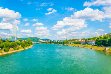 Riverside of Rhine dominated by the Roche tower in Switzerland - obrazy, fototapety, plakaty