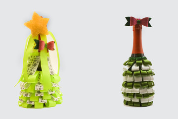 two bottles decorated with ribbons on a white background.