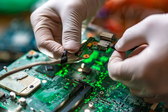 scientist assemble the modern technology gadget pieces in the laboratory f