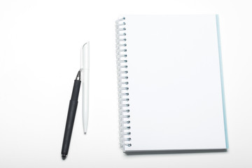 notepad notebook and ball pont pen isolated on white background