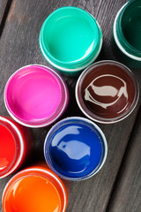 paint bottels on rustic wooden background