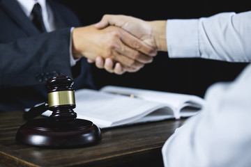 Congratulation and collaboration concept, Shaking hands after good cooperation, Businessman handshake with male lawyer after discussing good deal of contract in courtroom