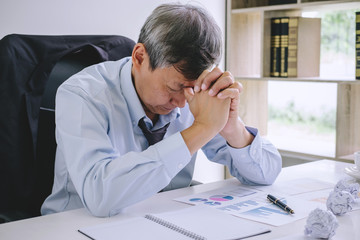 Feeling sick and tired, Senior businessman depressed and exhausted, businessman at his desk...