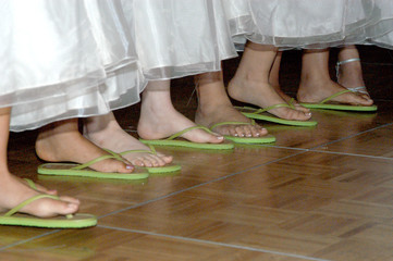 Girls dancing together in flip-flops