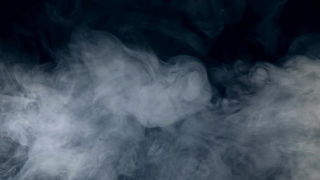 Dark background with flowing swirls of fog. Fog, smoke, cloud isolated on a black background.
