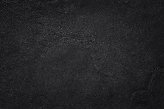 Dark grey black slate texture in natural pattern with high resolution for background and design art work. Black stone wall.