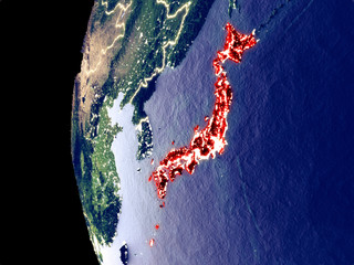 Night view of Japan from space with visible city lights. Very detailed plastic planet surface.