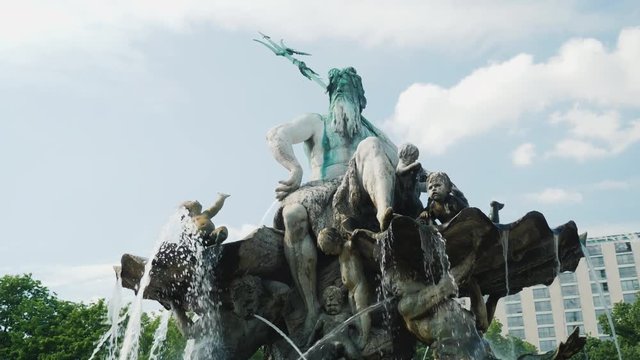 The Neptune Fountain is located in the center of Berlin between the church of Marienkirche and the Red Town Hall.