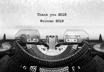 Vintage typewriter on white background with text thank you 2018, Welcome 2019.