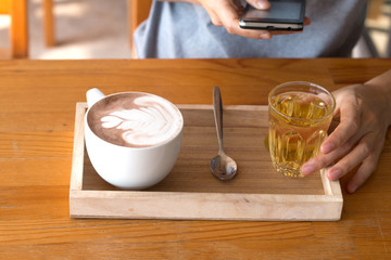 Woman enjoying warming drink, Late coffee in a cup