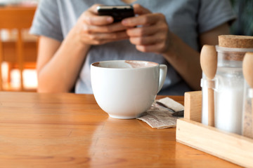 Woman enjoying warming drink, Late coffee in a cup