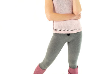 athletic thin girl, in pink gaiters and gray elk-do fitness exercises, pilates