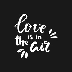 Hand written lettering quote about love and relationship. Hand drawn lettering phrase love is in the air.Valentine day lettering white on black
