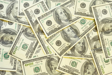 A background of hundred dollar banknotes.