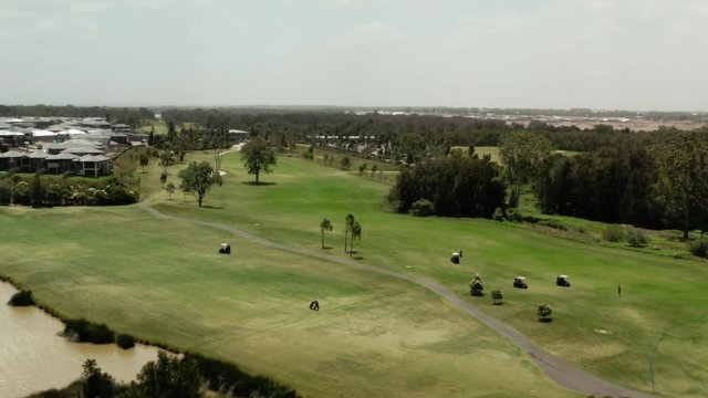Golfers Driving around the course in Golf Carts