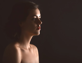 Fototapeta premium Beauty and skin care, woman's profile in soft light