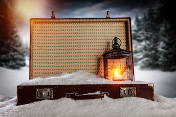 A winter suitcase full of snow in anticipation of Christmas   
