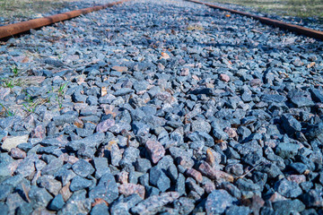 stones on the railway. the rails go away.