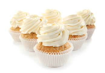 Delicious cupcakes on white background