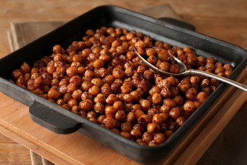 Backing tray with roasted chickpeas on table