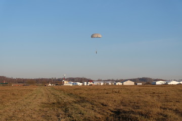 Airborne school. Paratrooper is landing..