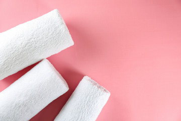 Soft towels on color background