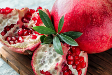 Ripe pomegranates on table, closeup