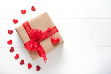 Beautiful gift with hearts on white table. Valentines Day celebration