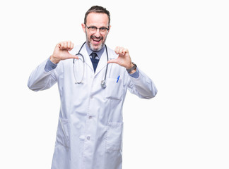 Middle age senior hoary doctor man wearing medical uniform isolated background looking confident with smile on face, pointing oneself with fingers proud and happy.