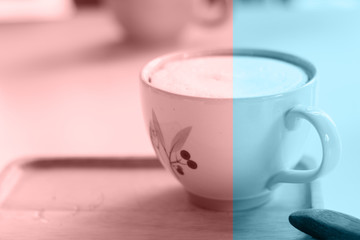 Close up a cup of hot latte coffee on white table