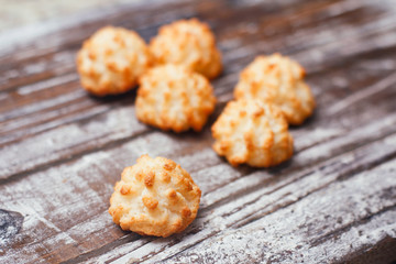 Set of coconut cakes on wooden table. Holiday treat. 