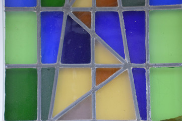 stained-glass window in different colors green blue and yellow