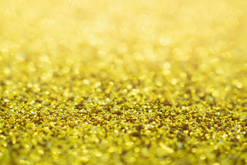 Abstract Gold glitter festive Christmas texture background blur with bokeh light