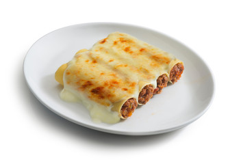 plate of cannelloni with ragù sauce, typical italian food dish