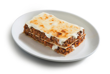 plate of lasagne with ragù sauce, typical italian food dish