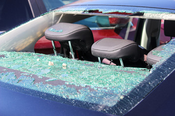 Rear windscreen of car smashed up, window broken