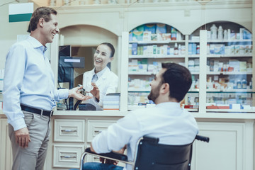Man Buys a Medicaments in Pharmacy