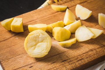 Cooked potato on a cutting board for slicing