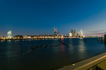 The skyline of Rotterdam, The Netherlands at blue hour. View is from the northern side of the river Maas.
