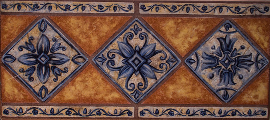 Detail of the traditional tiles from facade of old house. Decorative tiles.Valencian traditional tiles. Floral ornament.