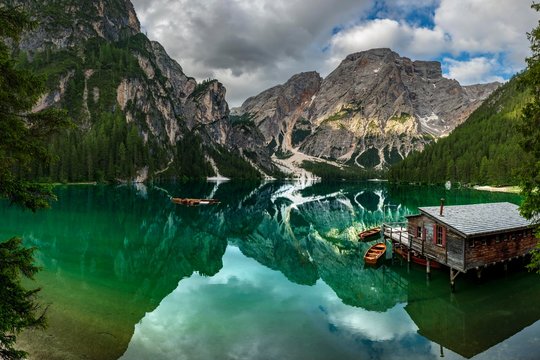 Lake Prags reflecting mountains, Dolomites, Italy