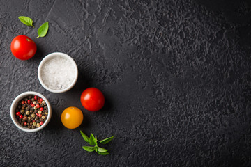 Red and yellow fresh tomatos, basil and olive oil