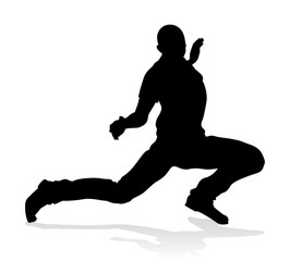 A male street dance hip hop dancer in silhouette