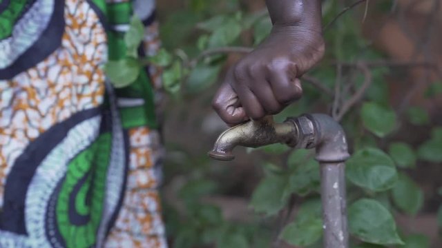 African Ethnicity Girl Collects Water in Slow Motion