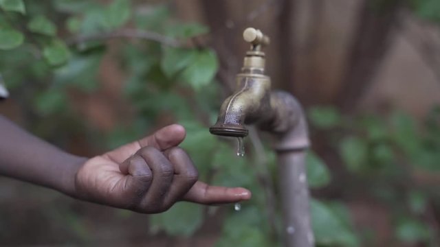Health Symbol - Clean Water for African children in HD Slow Motion