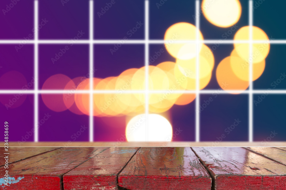Canvas Prints wooden desk with blurred light on road in city with bokeh abstract background