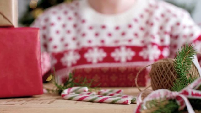 Girl preparing gifts for Christmas
