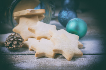 Glass jar Christmas cookies in the form of stars.